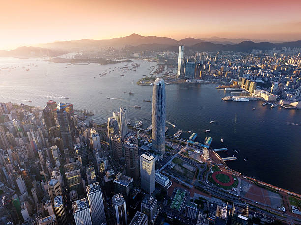 Aerial view of Hong Kong city, Victoria harbour in sunset stock photo
