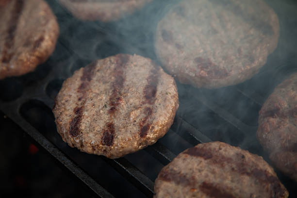 istock Burgers on a grill 594055234