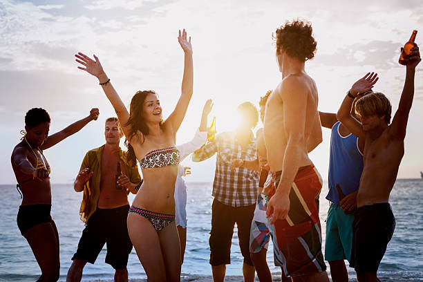 istock Beach Togetherness Holiday Crowd Friendship Concept 594056334