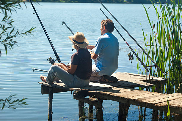 istock Older couple  fishing together 594056864