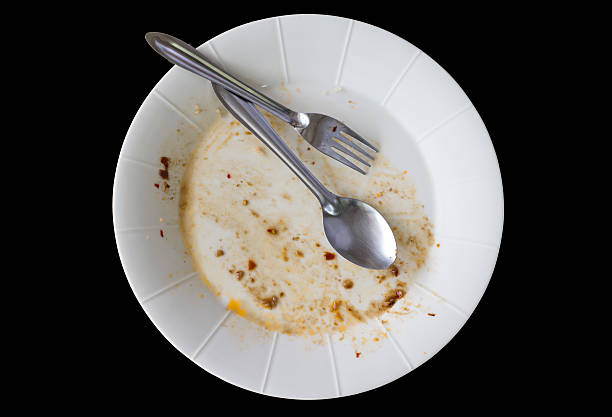 istock Rice dishes after eating isolated black background. 594057806