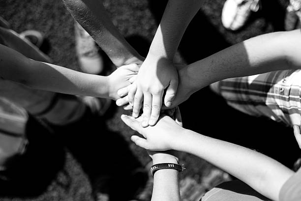 istock Hands, children, team, black and white 594058902