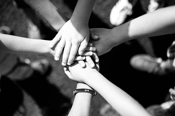 istock Hands, children, team, black and white 594059112