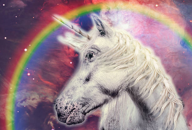 istock unicorn with rainbow in the galaxy 594060348