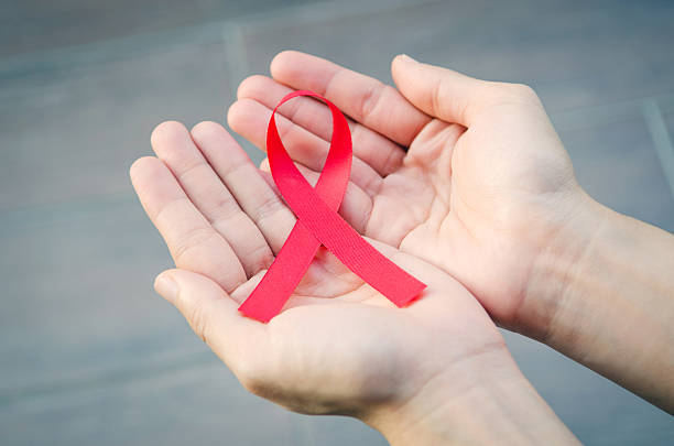 istock HIV, AIDS awareness ribbon. 594060654