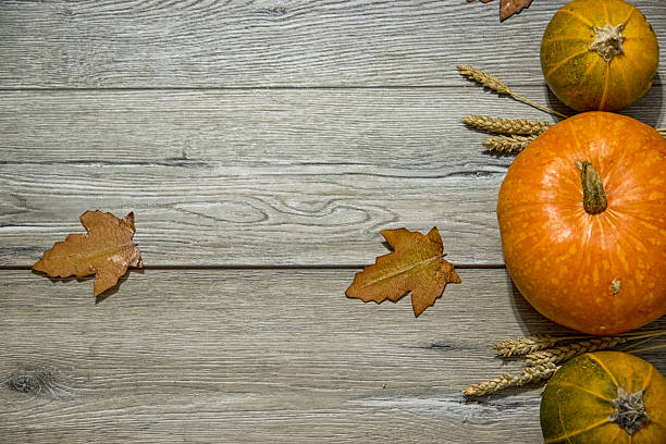 istock Pumpkins on a wooden table 594062248