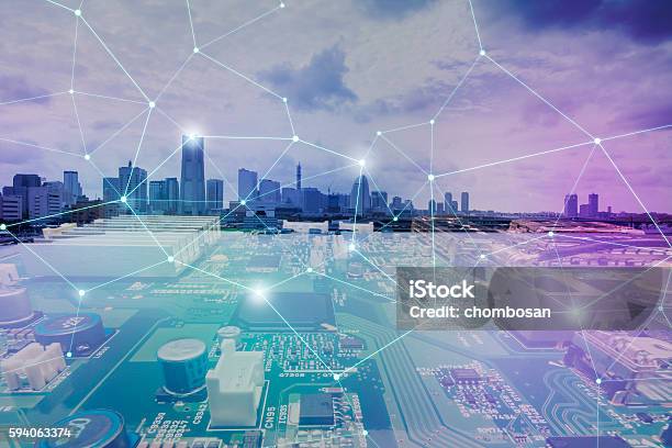 Fusion Of Modern Cityscape And Electric Circuit Board Stock Photo - Download Image Now