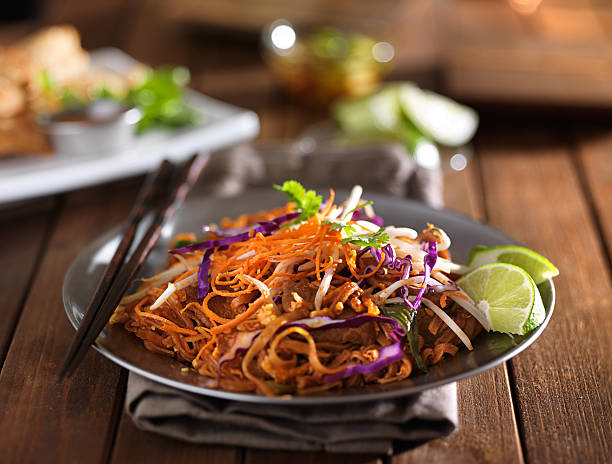 istock beef pad thai stir fry dish on plate with chopsticks 594065086