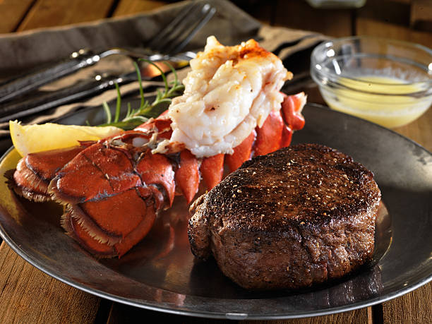 filet mignon steak with lobster tail surf and turf meal - surf and turf fotos imagens e fotografias de stock