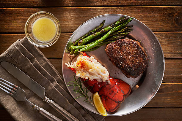 steak and lobster dinner flat lay composition - surf and turf fotos imagens e fotografias de stock