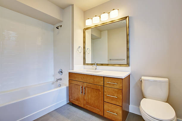 istock Bathroom interior in white tones and vanity cabinet. 594066348