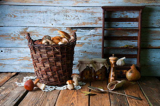 istock Fresh boletus in wicker basket in old rustic kitchen 594066580