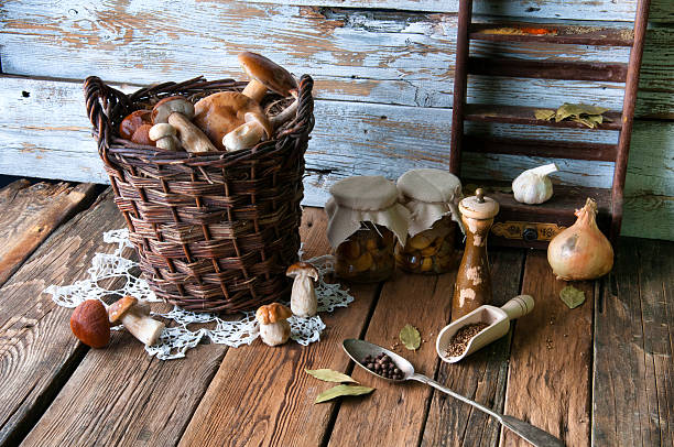 istock Fresh boletus in wicker basket in old rustic kitchen 594067456