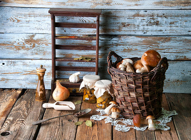 istock Fresh boletus in wicker basket in old rustic kitchen 594067862