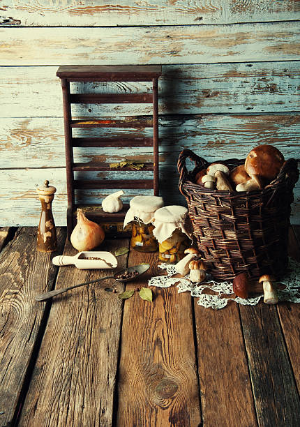istock Fresh boletus in wicker basket in old rustic kitchen 594068294