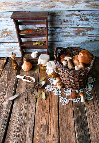 istock Fresh boletus in wicker basket in old rustic kitchen 594069190