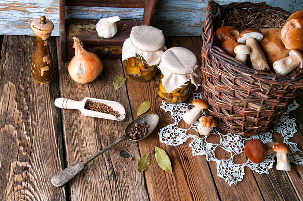 istock Fresh boletus in wicker basket in old rustic kitchen 594070736