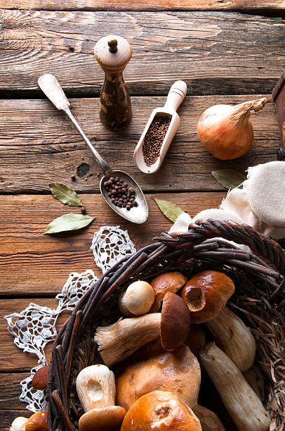 istock Fresh boletus in wicker basket in old rustic kitchen 594071174