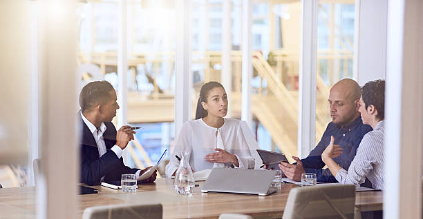 istock business people talking during meeting in modern offices 594071962