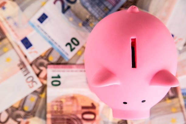 istock Euro bank notes and piggy bank 594072050