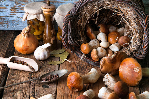 istock Fresh boletus in wicker basket in old rustic kitchen 594073774