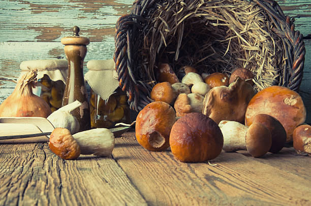 istock Fresh boletus in wicker basket in old rustic kitchen 594074874