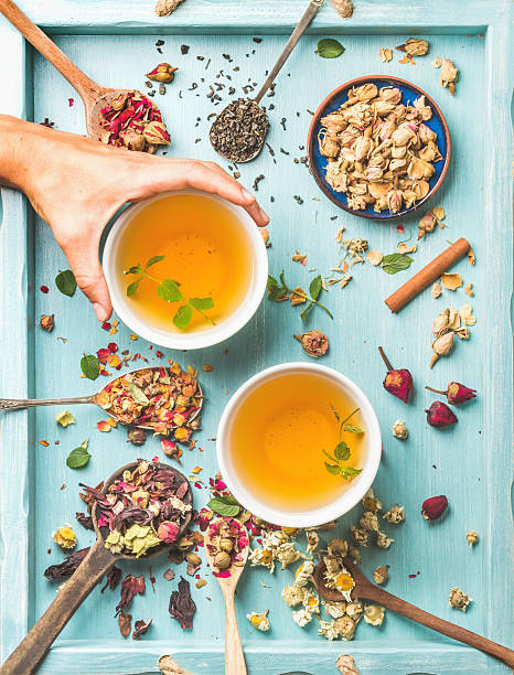 istock Two cups of healthy herbal tea with mint, cinnamon, dried 594075562