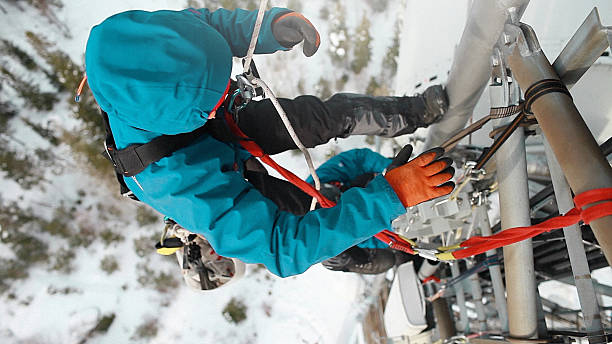 istock Telecommunication manual high worker engineer climbing an antenna 594075960