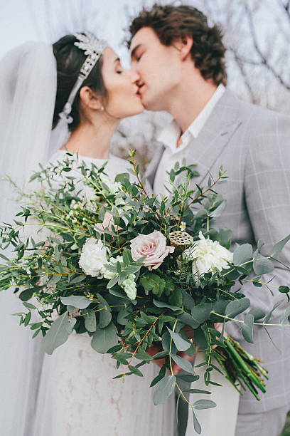 istock Kiss groom and bride 594076172