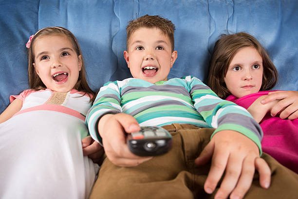 istock Happy friends watching tv 594078216