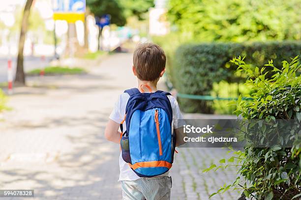 Little 7 Years Schoolboy Going To School Stock Photo - Download Image Now - Child, Backpack, School Building