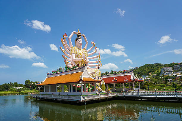 istock Buddhist Guan Yin statue at Plai Laem temple 594444654