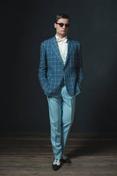istock Sharp dressed young man in retro 1920s style. Wearing sunglasses. 594444774