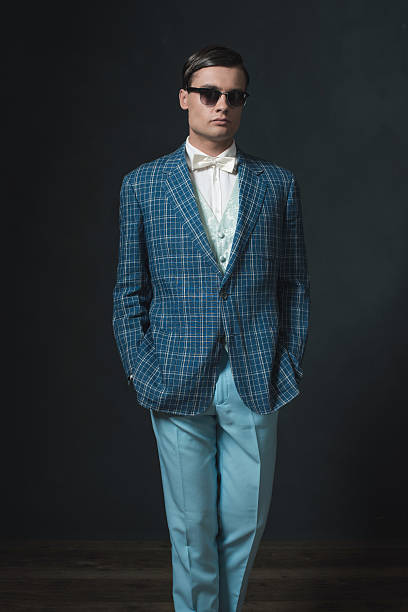 istock Sharp dressed young man in retro 1920s style. Wearing sunglasses. 594444820