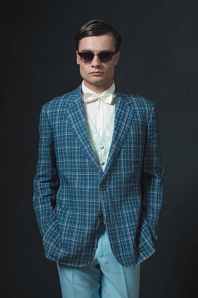 istock Sharp dressed young man in retro 1920s style. Wearing sunglasses. 594444850