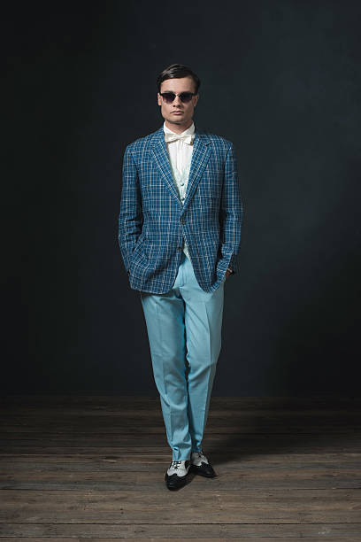 istock Sharp dressed young man in retro 1920s style. Wearing sunglasses. 594444874