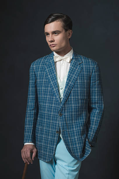 istock Vintage 1920s well dressed young man standing with cane. 594444918