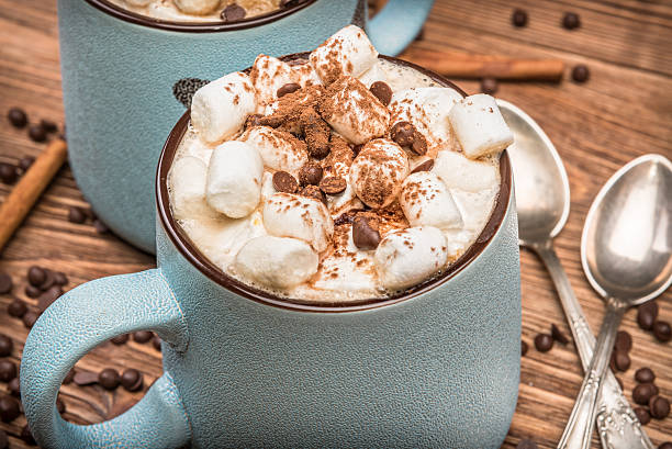 istock Cocoa with marshmallows and chocolate on a wooden table. 594444946