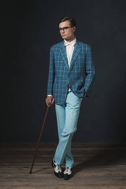 istock Retro 1920s fashion man wearing blue checkered jacket. 594445052