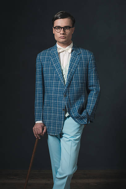 istock Retro 1920s fashion man wearing blue checkered jacket. 594445146