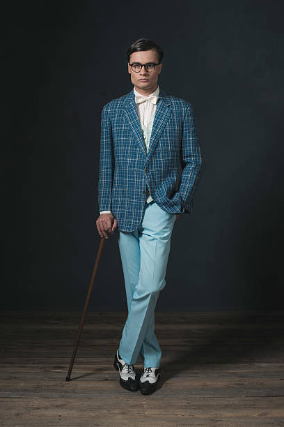 istock Retro 1920s fashion man wearing blue checkered jacket. 594445176