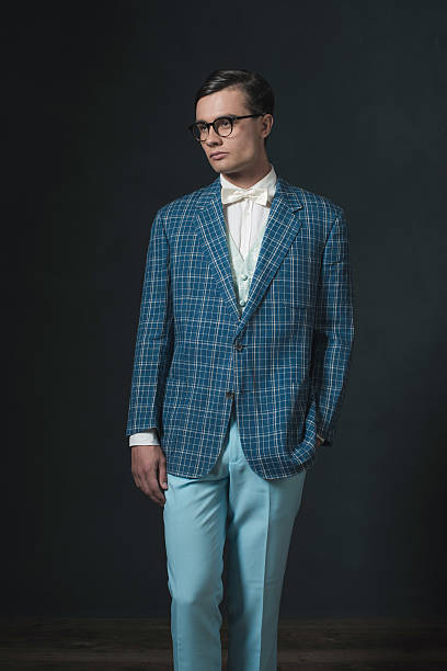 istock Retro 1920s dandy man wearing blue checkered jacket and pants. 594445204