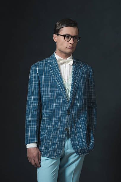 istock Retro 1920s dandy man wearing blue checkered jacket and pants. 594445260