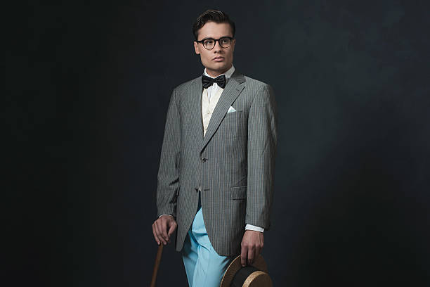 istock Retro 1920s business man with hat and cane. 594445362