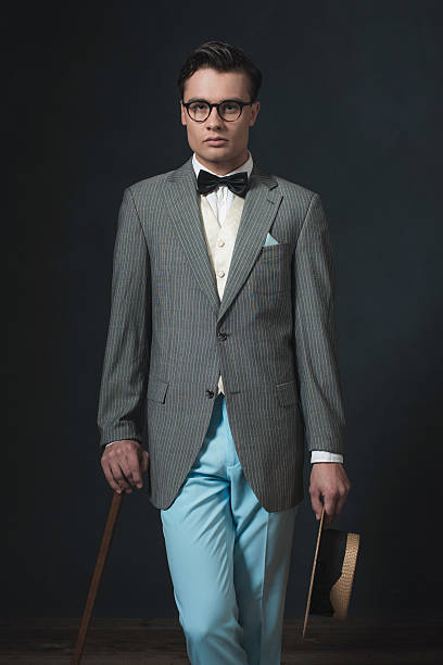 istock Retro 1920s business man with hat and cane. 594445474