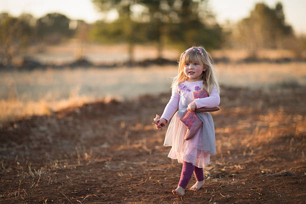 istock Barefoot Girl Outside 594445568