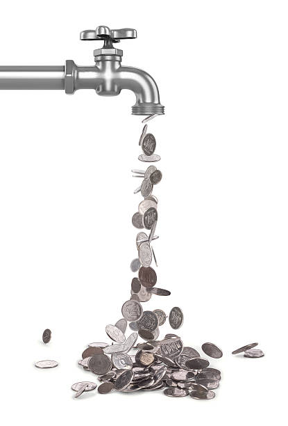 istock STERLING SILVER falling from the tap coins 594448306