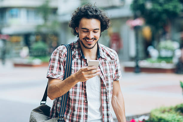 istock Checking messsages on the street 594448328