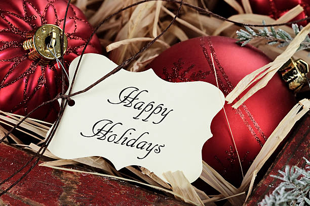istock Happy Holidays Tag and Christmas Ornaments 594448972