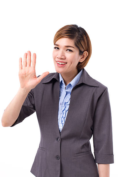 istock business woman pointing up five finger 594449040